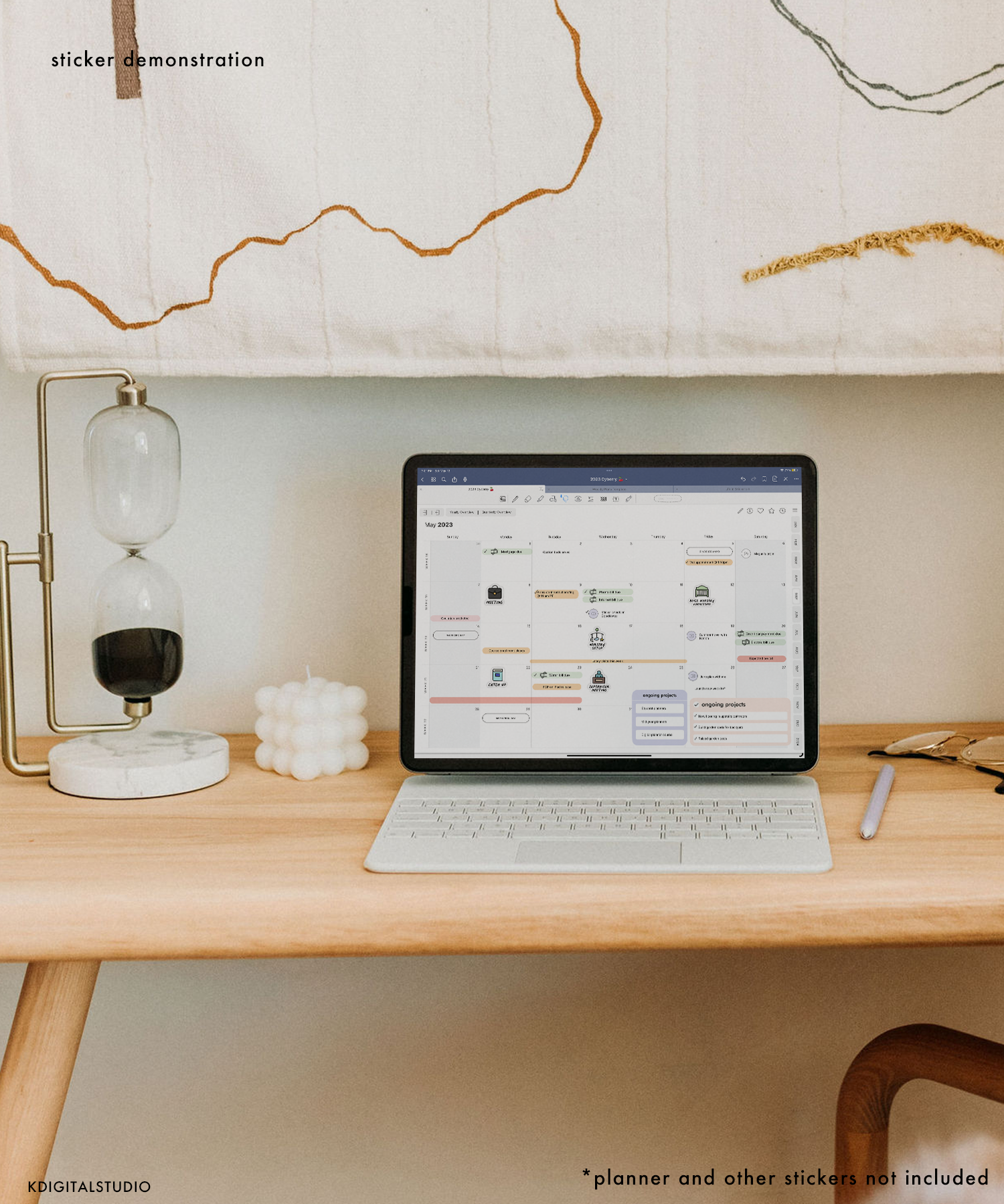 iPad sitting on desk featuring a digital planner that has the Life in Stickers set